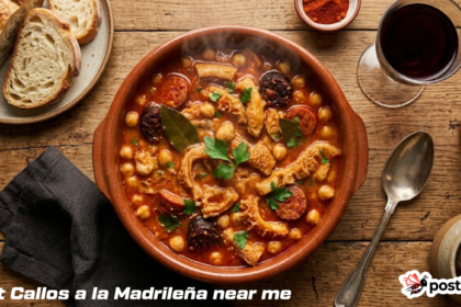 raditional Callos a la Madrileña stew served in a rustic clay bowl with crusty bread and wine.
