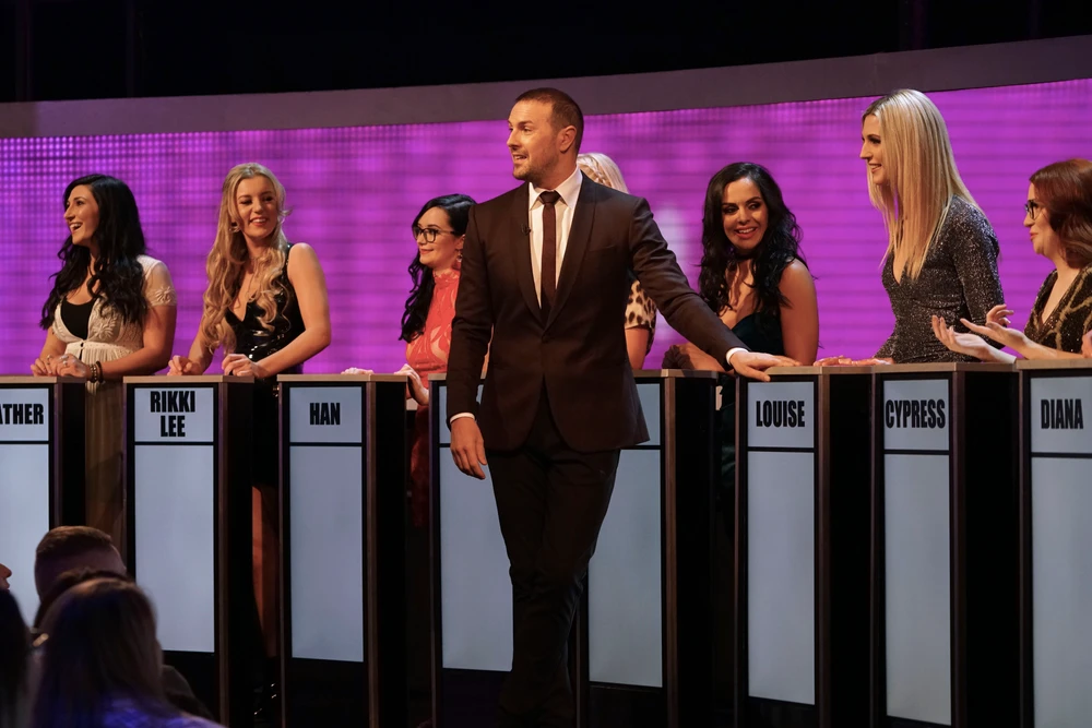 Paddy McGuinness hosting Take Me Out on stage