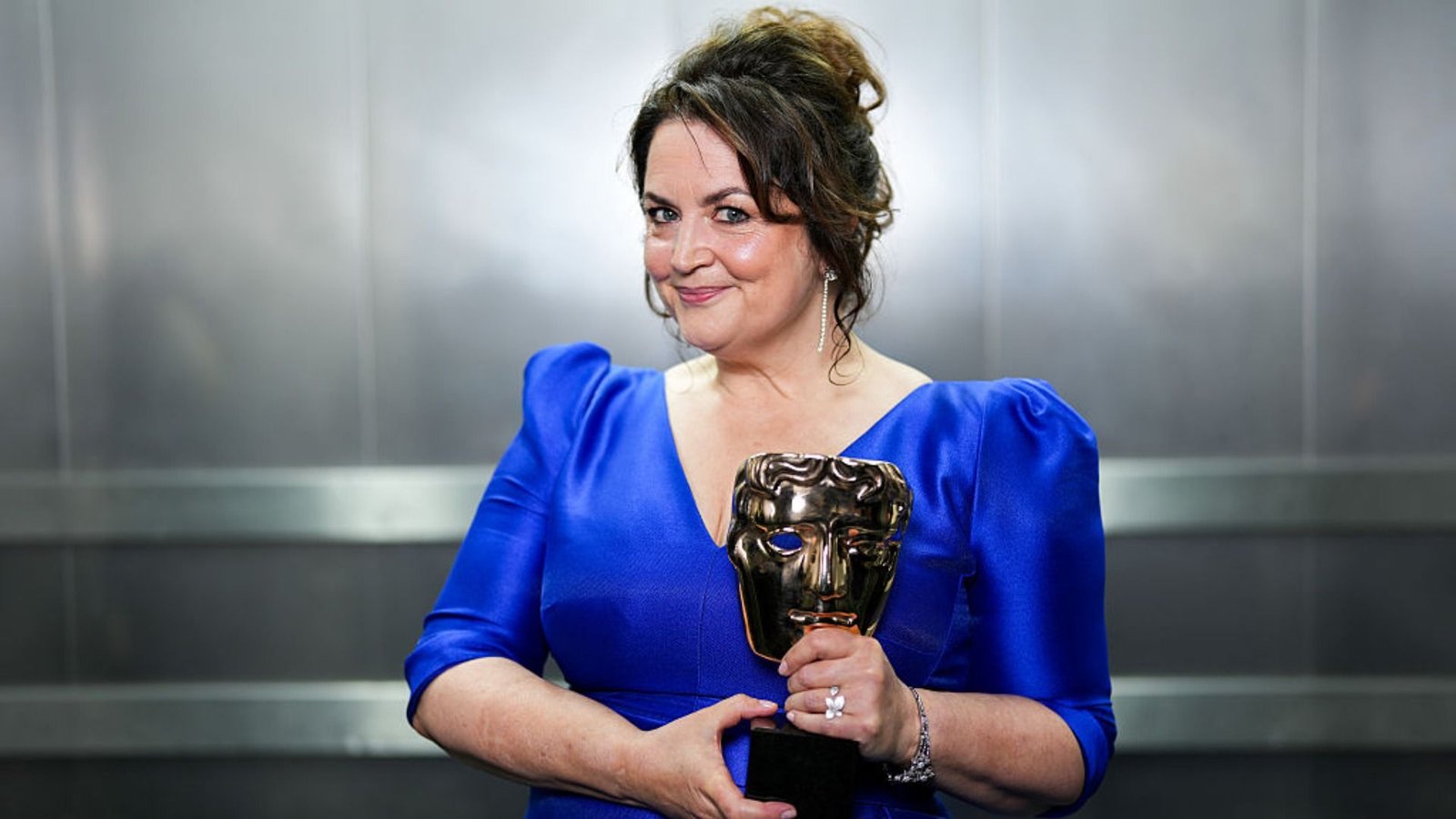 Ruth Jones holding her BAFTA award for Gavin & Stacey